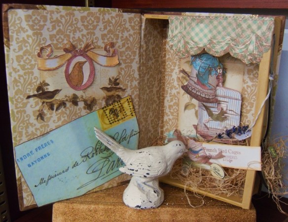 Winter won't last forever.  Spring is just around the corner.  Stop by the shop and see this sweet tweet.  It's a book box collage/assemblage.  Beautifully done!